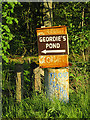 Signpost to Geordie's Pond in DD11 5RD