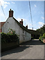 View west on The Street in Little Barningham in Little Barningham