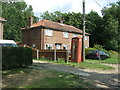 Houses and telephone box, Swathing in Cranworth