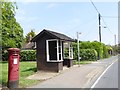 Post box and bus shelter by B1033 in CO13 0FL