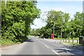 Junction of A4 with Barnfield and a phone box in SN8 3LG