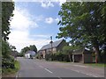 Bus shelter and houses, The Butts, Potterne in SN10 5PL