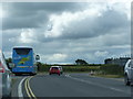 A38 heading south near Bristol airport, the Falcon bus parked on the verge in BS40 9YN