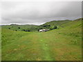 A grassy path, looking back to Tottlebank Farm in Blawith and Subberthwaite