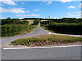Road junction and grass triangle in CB11 4XA