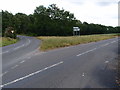 Road junction and grass triangle in SG17 5QL