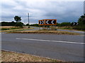 Road junction and grass triangle in Scaldwell