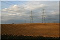 Ploughed fields and pylons in IP8 4JZ