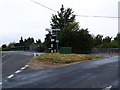 Road junction and grass triangle in HP27 9NE