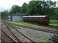 Coach W232W and engine shed, Bodmin and Wenford Railway in PL30 4BG