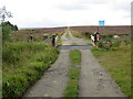 Track to Haworth Moor and Harbour Lodge crossing Cattle Grid in BD22 0EQ