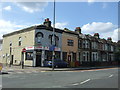 Hairdressers and houses on Lea Bridge Road (A104) in E10 7BH