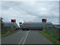 Freight train passing Welney Road Level Crossing, Manea in PE15 0HB