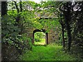 Archway through an old barn in CA11 0AT