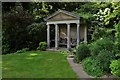 Kiftsgate Court Garden: Classical-styled building serving as a seating area in GL55 6RX