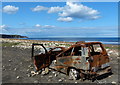 Rusting vehicle on Horden Beach in SR8 4LX