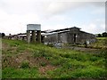 Disused poultry shed and water tank in NR9 5WR