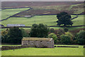 Barn or barns astride dry stone wall in DL11 6UH