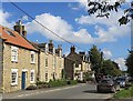 Houses and pub, Welburn in YO60 7EA