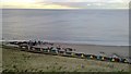Beach huts below West Cliff, Whitby in YO21 3JL