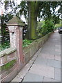 Stone post in front of Newton Mews with a bench mark in CH2 2DW