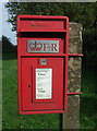 Close up, Elizabeth II postbox on Lynn Road, Roydon in PE32 1AT