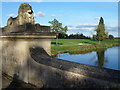Monumental lion on The Lion Bridge in Burghley Park in St. Martin's Without