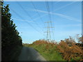 Power lines making a cats-cradle with vapour trails, near Waun Castellau in CF72 8LQ