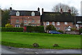 Cottages overlooking the green at Urchfont in SN10 4RA