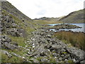 Rocky path along the western shore of Llyn y Manod in LL41 4AU