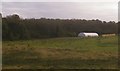 Farming structures at Jimmy's Farm, from the railway in IP9 2AP
