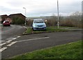 Car on  a grass triangle in Bettws in CF32 8SW