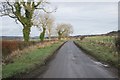 Road looking northeast from the entrance to Muirhead Farm in PH2 9BY