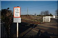 Signs at the crossing in Etton