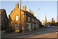 Row of houses on Church Street and spire of St Mary's Church in OX15 4SR