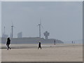 People and sculptures on Crosby Beach in L23 6TQ
