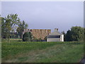 Straw bales higher than house on Dairy Drove in CB6 1RR