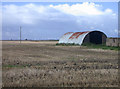 Nissen hut with distant windfarm. in PE15 0HH