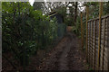 Fenced section of path towards Colley Hill in KT20 7HN