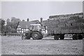 Loaded trailer and tractor, Bridge End Farm, Davenham in CW9 8LW