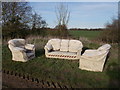 Fly-tipped sofa and armchairs near Glinton in PE6 7PA