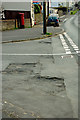 A structural failure in the road surface at the junction of  B3233 with Babbages in EX31 2FJ