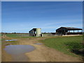 Farm buildings beside footpath from Little Clanfield in OX18 2SA