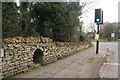 Stone wall with underpass, B6403 in Ancaster in NG32 3PU