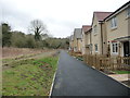 Houses fronting onto a path, Nelson Ward Drive, Radstock in BA3 3ES