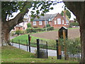 Looking through the church gates to the school in the next square in Old Newton
