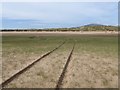 Vehicle tracks on Hodbarrow Bank in LA18 4HH