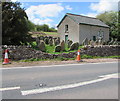 Damaged stone wall on the west side of the A479, Pengenffordd, Powys in LD3 0EW