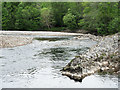 Rock protruding into flow of River Garry in PH16 5LJ