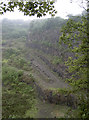 A road at the bottom of the quarry cliffs in BS48 3JF